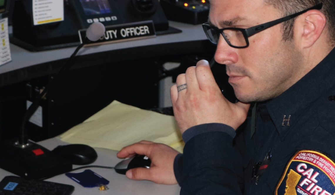 CAL FIRE Duty Officer taking a phone call. 