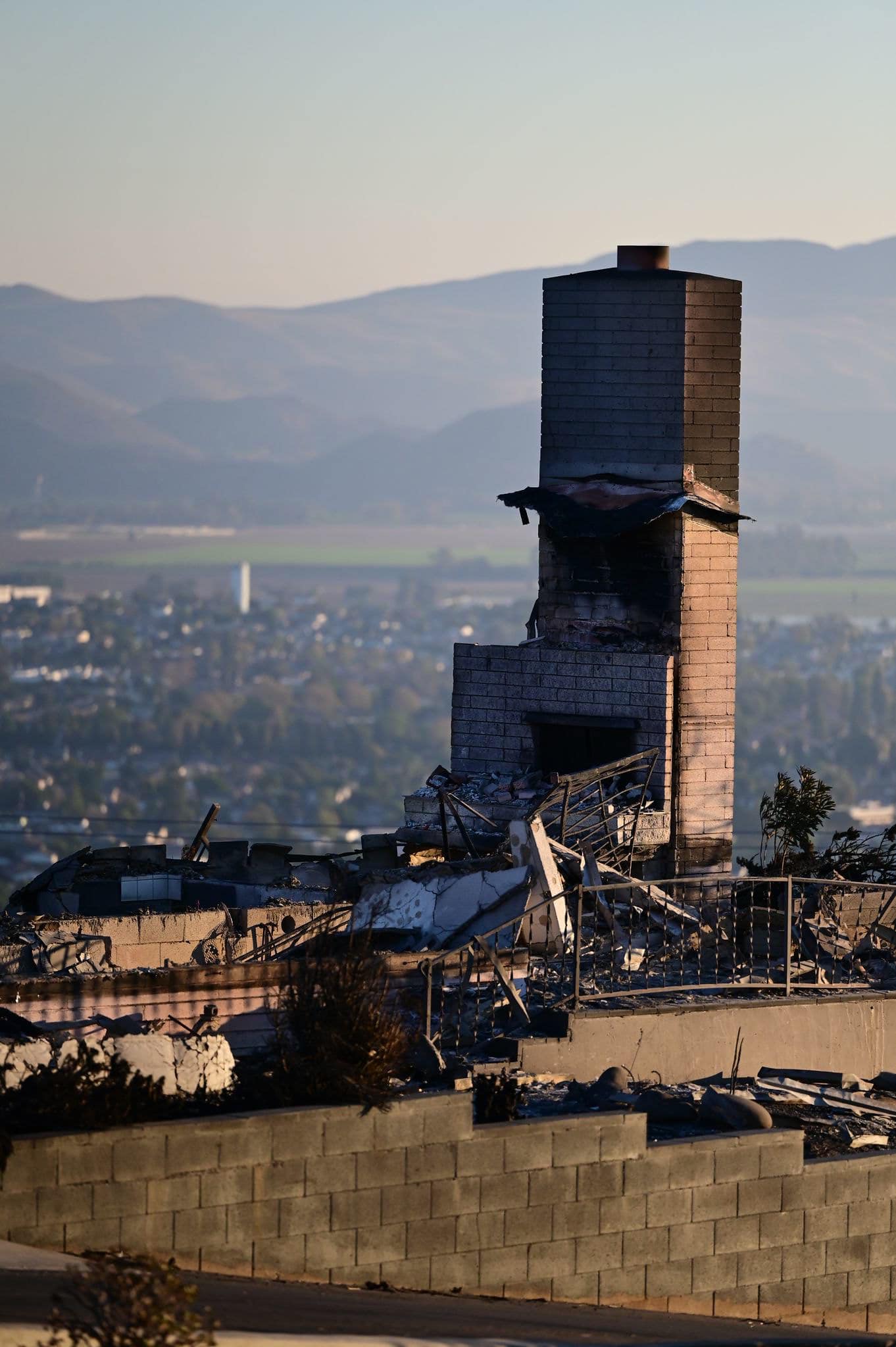 A chimney stands i a burned out building